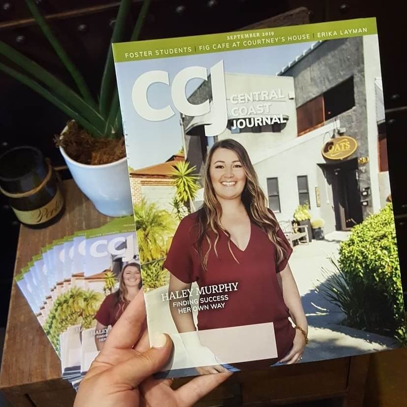 Woman being spray tanned at OATS SLO tanning & airbrush Salon