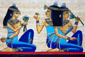 Papyrus featuring ancient Egyptian women handling flowers, herbs and other cosmetic ingredients