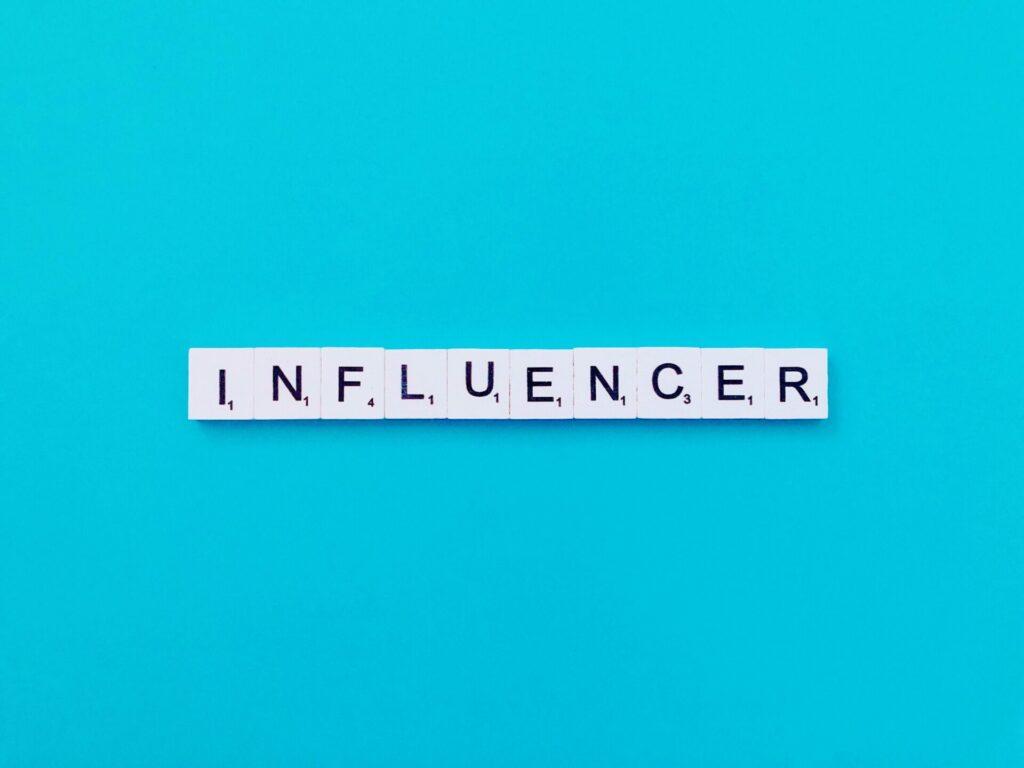 scrabble pieces spelling Influencer