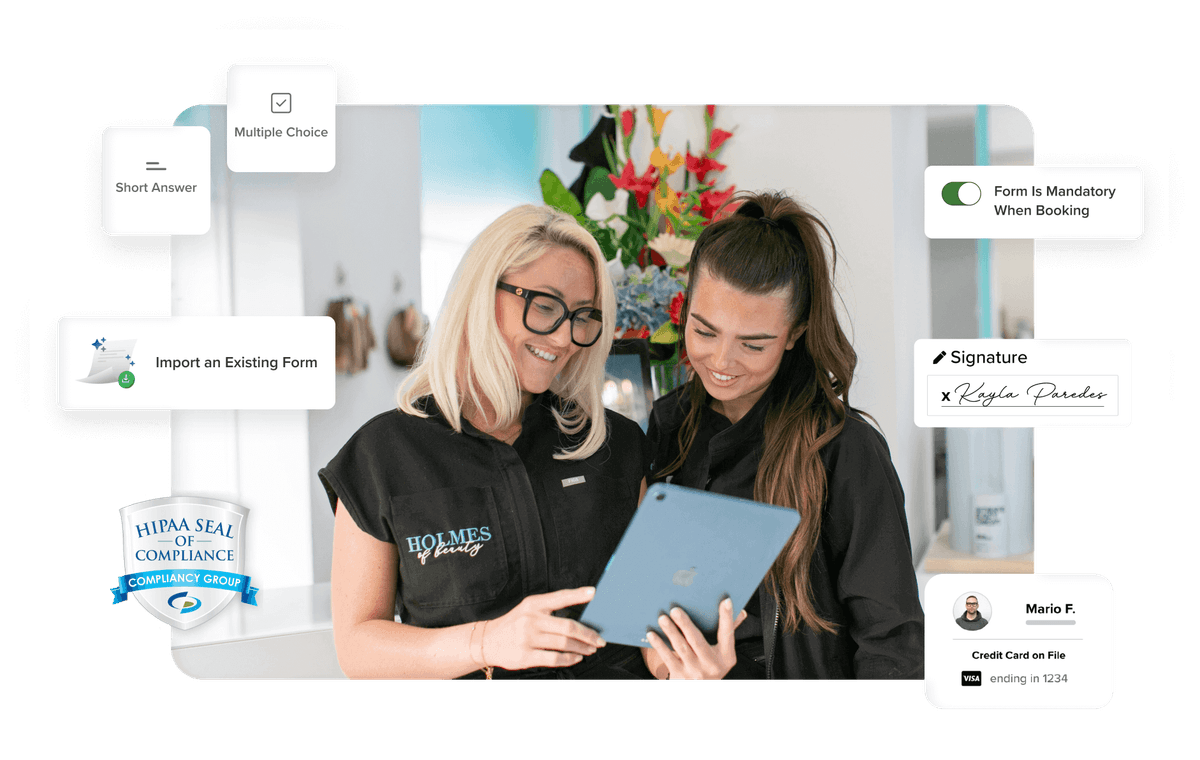 Beauty professionals reviewing a client intake and liability form on their mobile device with HIPAA compliance badge