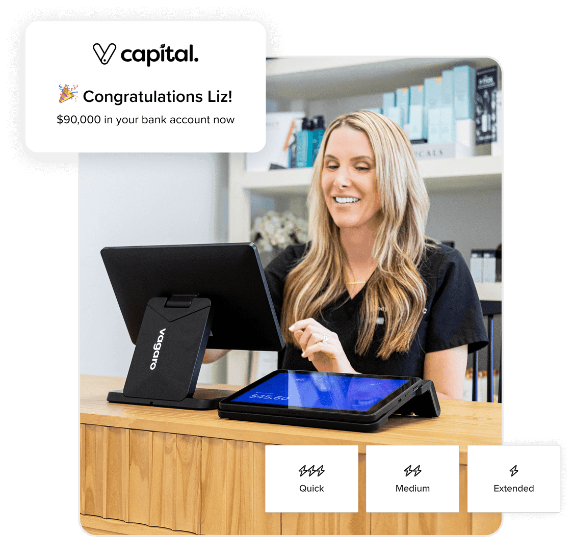 Business owner on POS device smiling because she just received funding for her business